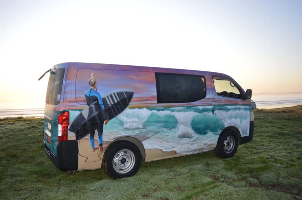 Escape rentals summer A compact Escape campervan parked up by the New Zealand coast.
