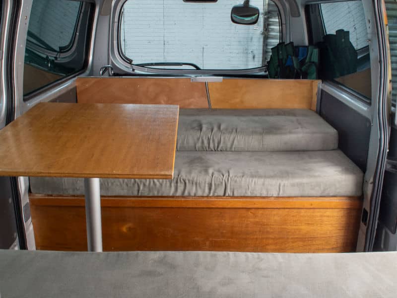 Escape Rentals NZ Our Campervan interior 12 - Standard campervan interior: Smart design — convert your bed to a dining area.